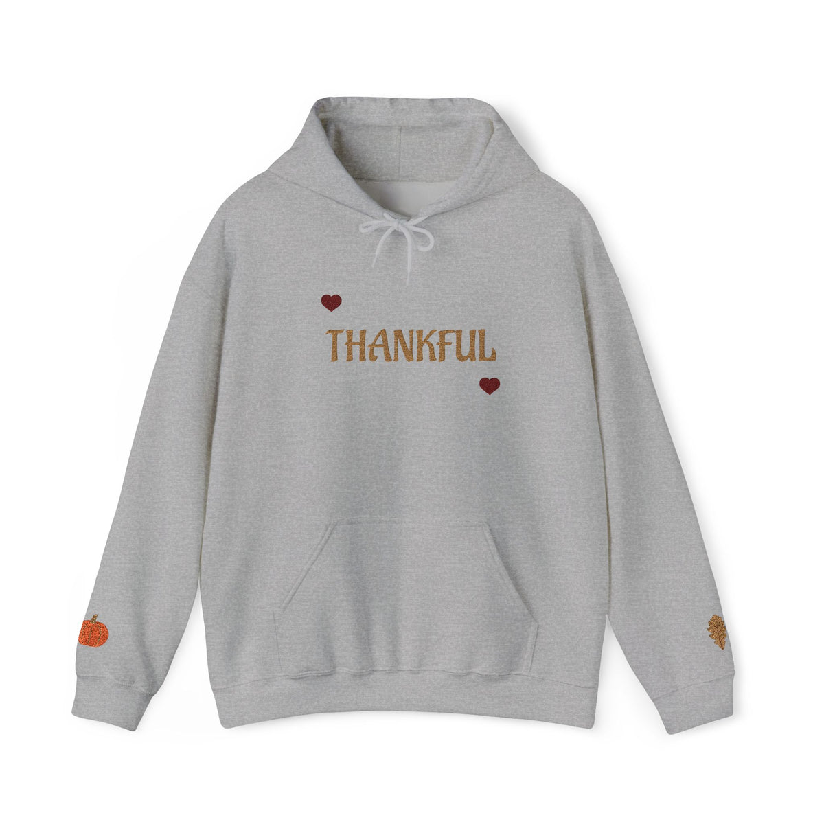 A light gray heather pullover hoodie with 'THANKFUL' printed in brown across the chest, flanked by two small red hearts. The hoodie features a white drawstring hood, a front kangaroo pocket, and small autumn-themed graphics on the cuffs, including a small orange pumpkin on the left sleeve and a leaf on the right sleeve.