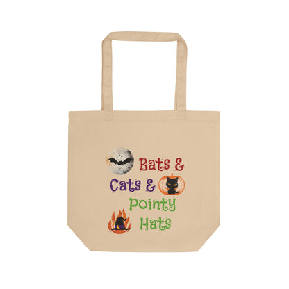 Beige tote bag with Halloween-themed text and graphics on a white background
